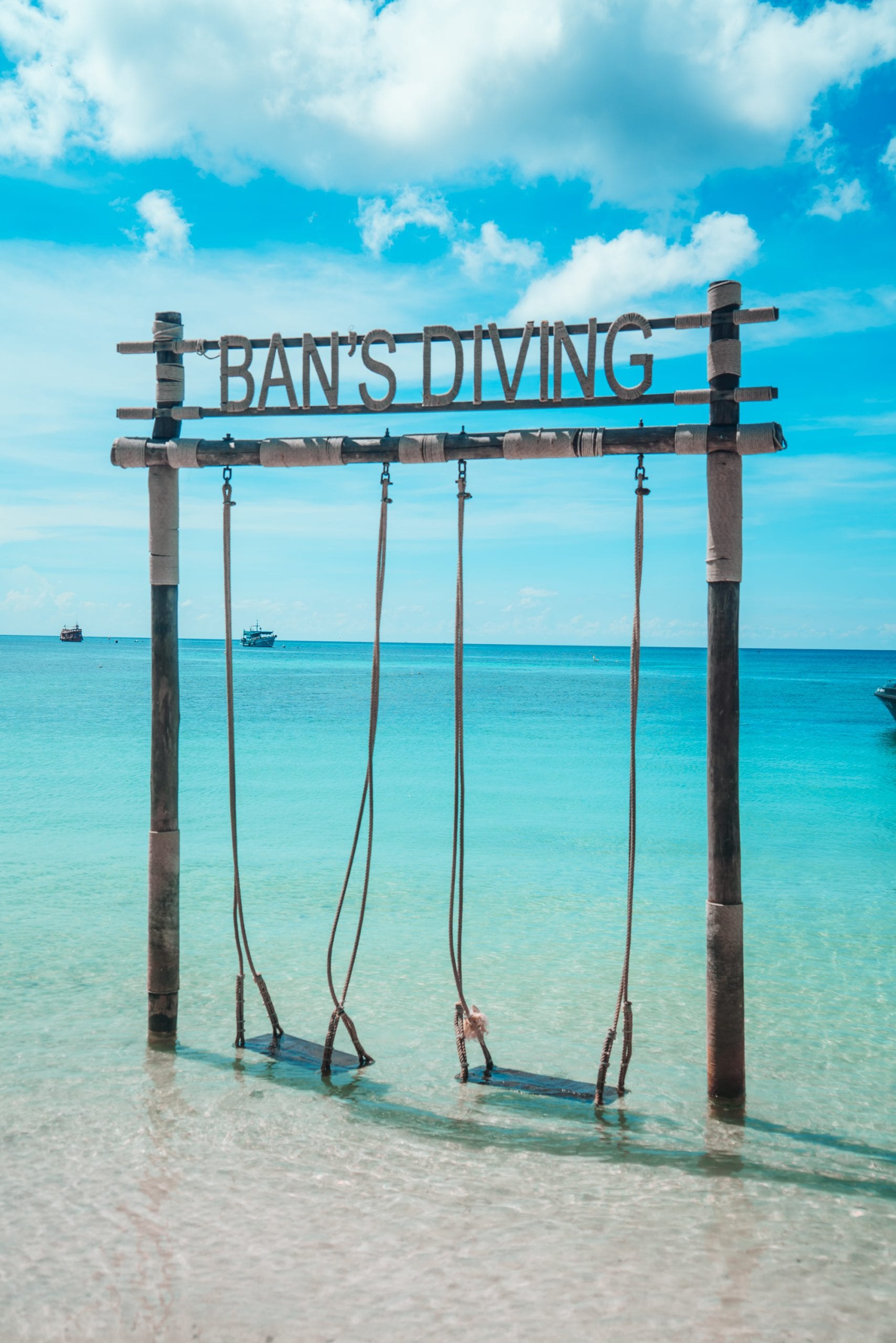 A Koh Tao dive and freediving school sign on the beach front
